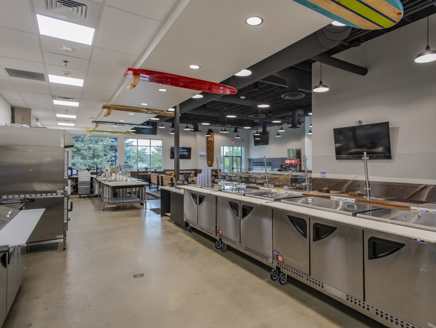 Beach theme decorative details Longboards Pizza commercial construction Nampa